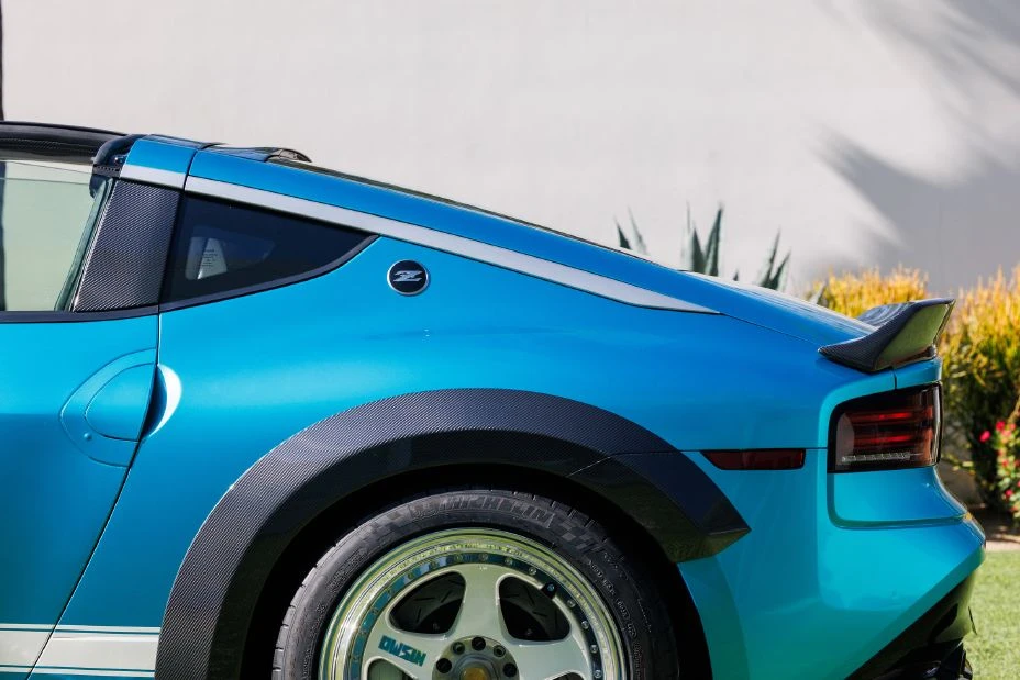 Close-up of the Nissan Z Kaze concept’s rear-quarter panel, restored LMGT2 wheel and carbon-fibre flare.